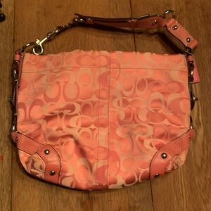 This is a Coach Carly Optic Signature Shoulder Bag, Hobo Bag Style.